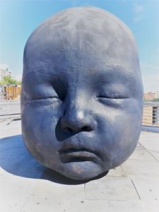 Madrid Quiz: one of the baby heads in Atocha: sculpture by Antonio López